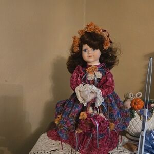 Vintage Porcelain Doll with Floral Dress